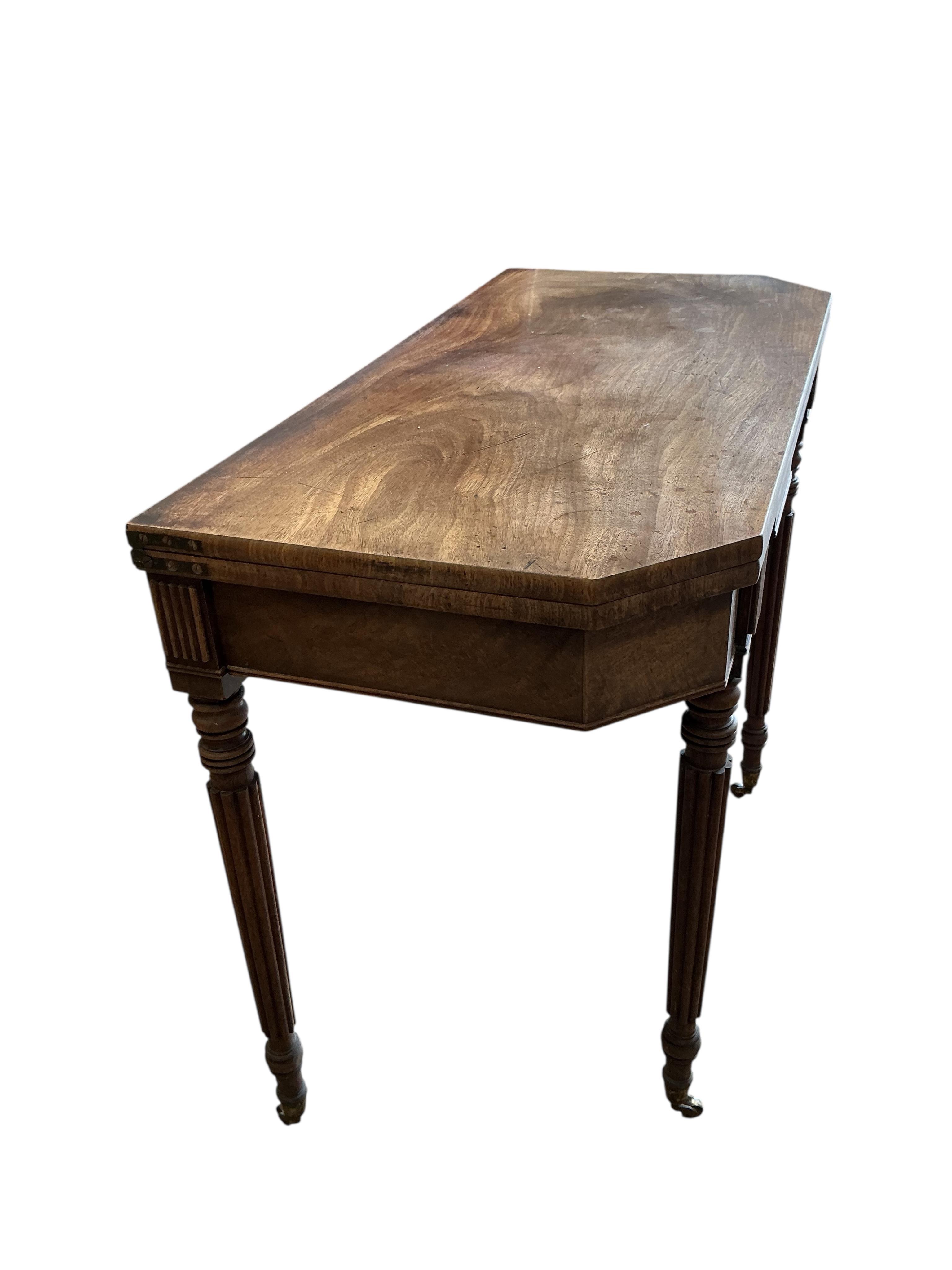 A Regency mahogany folding tea table, width 91cm, depth 45cm, height 74cm